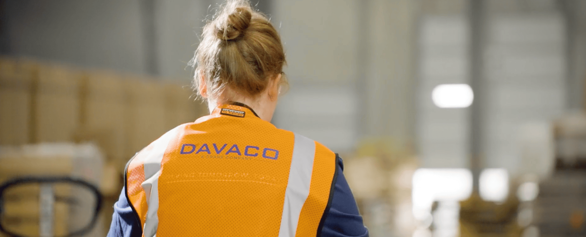 DAVACO warehouse and logistics staff member in a safety vest