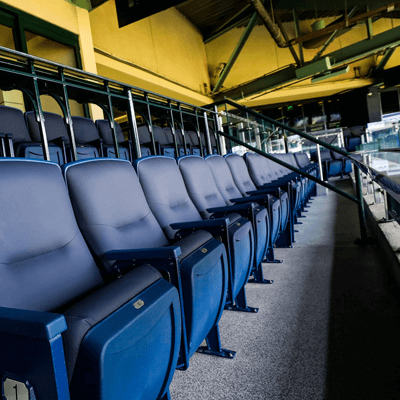 Row of blue stadium seats at the Houston Astros Stadium.