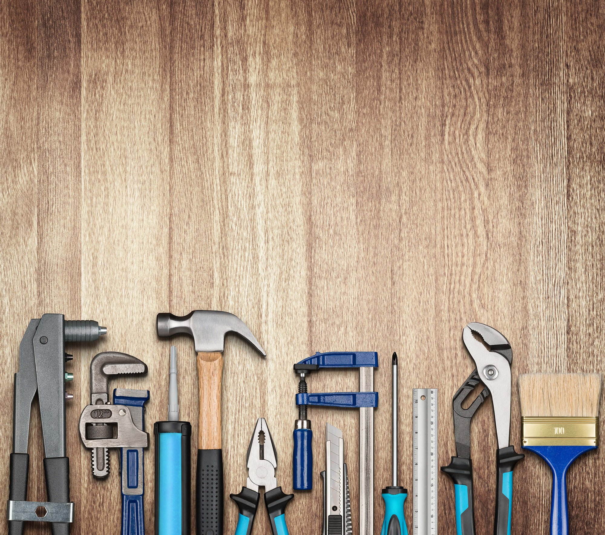 Hammer, vice grip, pliers and other hand tools, showcasing a wide variety of facility services.