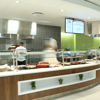 Remodeled US Air Force dining counter, staffed with professional chefs and designed in eco friendly wood and green hues.